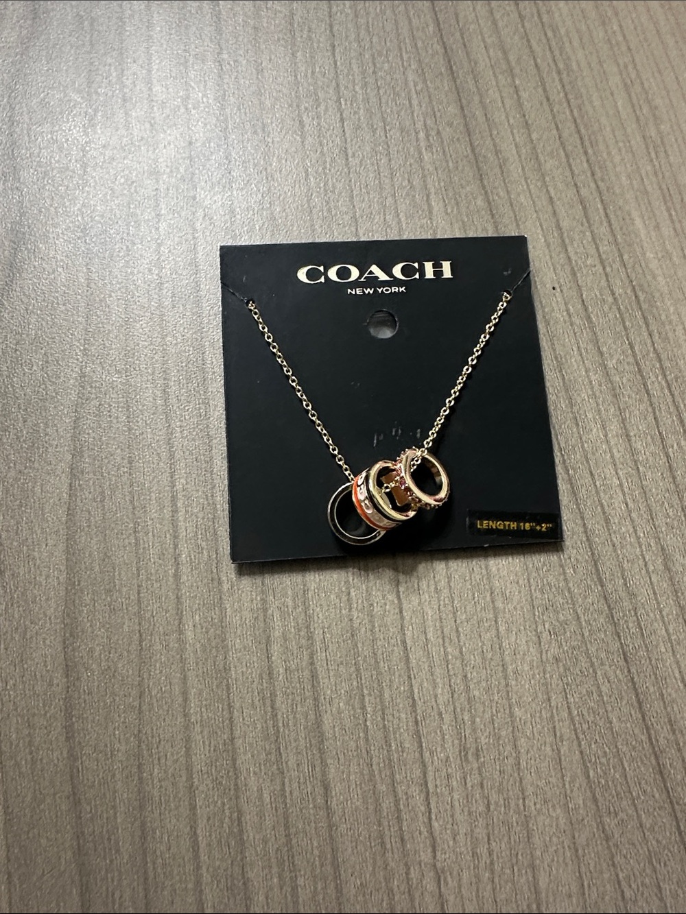 COACH Gold-Tone Necklace with Pink Enamel & Black Rings
